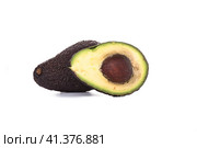 Two Haas Avocado Fruits Isolated Over White Background. Стоковое фото, фотограф Сергей Долгов / Фотобанк Лори