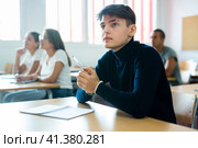 Boy focused on lecture in university. Стоковое фото, фотограф Яков Филимонов / Фотобанк Лори