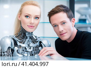 Молодой ученый с роботом. Generative AI. Стоковое AI-изображение, AI-художник Щеголева Ольга / Фотобанк Лори