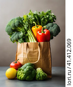 A variety of fresh vegetables in a craft eco-friendly package. Generated by AI. Стоковое AI-изображение, AI-художник Ярославский Максим / Фотобанк Лори
