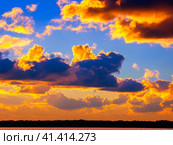 Beautiful sunset sky above clouds with dramatic light. Yellow, orange, red clouds above the horizon. Beautiful evening sky landscape. Sunset over the sea. Generated by artificial intelligence. Стоковое AI-изображение, AI-художник Юлия Петровская / Фотобанк Лори