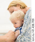 Child beeing vaccinated by pediatrician in presence of his mother. Preventive vaccination against Diphtheria, whooping cough, tetanus, hepatitis, haemophilus influenzae, pneumococcus, poliomyelitis. Стоковое фото, фотограф Matej Kastelic / Фотобанк Лори