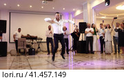 Nizhny Novgorod, Russia, Kazan highway 9, 08.31.2023. Armenian lezginka, A man dancing lezginka at a wedding banquet.  Нижний Новгород, Россия, Казанское шоссе, 9, 31.08.2023. Армянская лезгинка, мужчина танцует лезгинку на свадебном банкете. Редакционное видео, видеограф Egor Sarantstv / Фотобанк Лори
