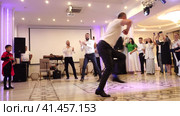 Nizhny Novgorod, Russia, Kazan highway 9, 08.31.2023. Armenian lezginka, A man dancing lezginka at a wedding banquet.  Нижний Новгород, Россия, Казанское шоссе, 9, 31.08.2023. Армянская лезгинка, мужчина танцует лезгинку на свадебном банкете. Редакционное видео, видеограф Egor Sarantstv / Фотобанк Лори