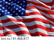 American flag waving in the wind. Стоковое фото, фотограф Nobilior / Фотобанк Лори