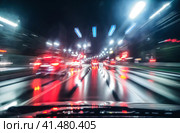 Скорость движение по ночному городу в дождь. Night rainy highway. High-speed traffic and blur on a long exposure. Neon lights of city. Стоковое фото, фотограф Евгений Горбунов / Фотобанк Лори