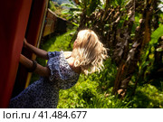 Extreme lady tourist travelling to sri lankan train in Sri Lanka, enjoying looking. Traveler woman enjoy fun trip train ride by tropic landmarks. Touristic journey tropical concept. Copy ad text space (2022 год). Стоковое фото, фотограф Aleksandr Golubev / Фотобанк Лори