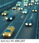 Blurred photography of cars motion. Big traffic in city. Urban highway filled out by cars. Rush hours. To be late. Work out. Cold blue with grey colors of the sunset in the January. Стоковое фото, фотограф YuryKara / Фотобанк Лори