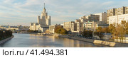 Moscow, Russia - October 5, 2018:  Architecture in the city center. Stalinist skyscraper on Kotelnicheskaya, Bolshoy (Big) Ustinsky Bridge. International touristic concepts. Wide Moscva river. Редакционное фото, фотограф YuryKara / Фотобанк Лори