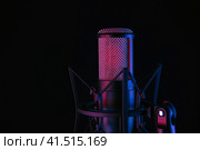 Studio black condenser microphone on black background. Стоковое фото, фотограф Александр Калугин / Фотобанк Лори