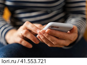 women's hands that confidently hold a smartphone, modern technology. Стоковое фото, фотограф Андрей Знаменский / Фотобанк Лори