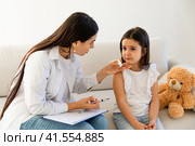 Doctor giving injection to little girl in hospital, closeup. Immunization concept. child is scared and crying. Стоковое фото, фотограф Ирина Михайличенко / Фотобанк Лори