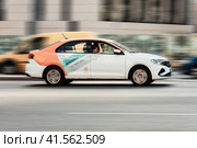 Car-sharing delimobil car Volkswagen Polo in motion on Moscow street. Редакционное фото, фотограф Константин Григорьев / Фотобанк Лори