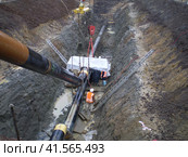 Laying of the gas pipeline in a ditch. Installation works. Стоковое фото, фотограф Леонид Еремейчук / Фотобанк Лори