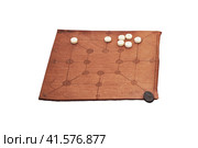 Mill game, popular in ancient Roman, isolated on a white background. Reconstruction of board games from the Roman Empire. Стоковое фото, фотограф Андрей Журавлев / Фотобанк Лори