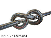 Chromed pipe tied in a knot isolated. Стоковое фото, фотограф Юрий Бизгаймер / Фотобанк Лори