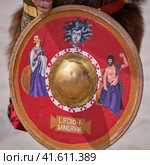 Red shield of Legion 1 Minervia the Ancient Roman Empire - Times and Epochs Festival, Moscow, Russia, June 08, 2023. Редакционное фото, фотограф Андрей Журавлев / Фотобанк Лори