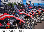 Row of firemans motorcycles BMW G5 parked in the parking lot. The concept of road safety - Moscow, Russia, 05 September 2023. Редакционное фото, фотограф Андрей Журавлев / Фотобанк Лори