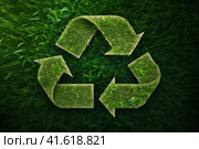 Recycle symbol made of green plants and leaves on grass background. Eco recycling concept. AI generated. Стоковое AI-изображение, AI-художник Александра Селина / Фотобанк Лори