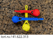 Braided paracord keychains on a cork background. Handmade, creative design. Стоковое фото, фотограф Артем Лукин / Фотобанк Лори