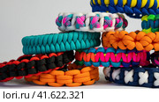Lots of braided paracord bracelets. Стоковое фото, фотограф Артем Лукин / Фотобанк Лори