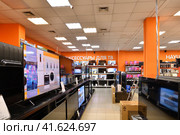 Moscow, Russia - Oct 19. 2023. TVs and and others in DNS network store selling household appliances in Zelenograd. Редакционное фото, фотограф Володина Ольга / Фотобанк Лори