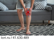 Knee pain, man suffering from osteoarthritis at home. Стоковое фото, фотограф Станислав Тарко / Фотобанк Лори