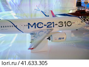 A model of a modern Russian aircraft MC-21-310 with a PD-14 engine - Moscow, Russia, November 05, 2023. Редакционное фото, фотограф Андрей Журавлев / Фотобанк Лори