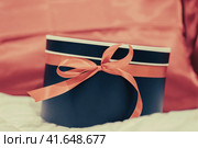 gift surprise box with red ribbon. Стоковое фото, фотограф Артем Курутин / Фотобанк Лори