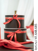gift surprise two boxes with red ribbon. Стоковое фото, фотограф Артем Курутин / Фотобанк Лори