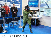 Training in combat and rescue operations in virtual reality HTC Vive at exhibition Interpolitex - Moscow, Russia, 10 25 2019. Редакционное фото, фотограф Андрей Журавлев / Фотобанк Лори