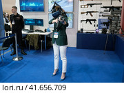 Training in combat and rescue operations in system virtual reality HTC Vive at exhibition Interpolitex - Moscow, Russia, 10 25 2019. Редакционное фото, фотограф Андрей Журавлев / Фотобанк Лори