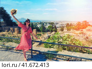 Woman tourist near the gulf and the ruins of Carthage from Byrsa Hill. Tourism in Tunisia, North Africa. Mandraki bay is artificial, created in antiquity. (2019 год). Стоковое фото, фотограф Андрей Журавлев / Фотобанк Лори