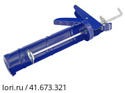 Ручной монтажный пистолет для клея на белом фоне. Silicone glue gun, isolated on white background. Стоковое фото, фотограф Татьяна Д / Фотобанк Лори