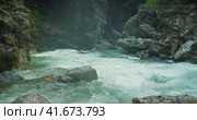Evaporation over a cold mountain river with clear water in rocky gorge. Summer nature landscape. Стоковое видео, видеограф Igor Tichonow / Фотобанк Лори