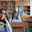 A student poses with textbooks at her desk in her class. Стоковое фото, фотограф Mikhail Davidovich / Фотобанк Лори