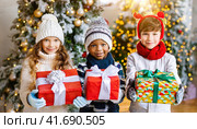 Happy children received gifts for St. Nicholas Day. Christian Holiday celebrated on December. Tradition of giving gifts to children on behalf of Saint Nicholas. Стоковое AI-изображение, AI-художник Igor Tichonow / Фотобанк Лори