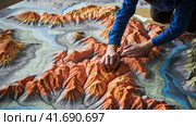 Geographer exploring the terrain on the model. Стоковое AI-изображение, AI-художник Кирилл Черезов / Фотобанк Лори