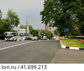 Ramenskoe, Russia - June 15, 2019. Perspective of Karl Marx street in Ramenskoye of Moscow oblast. Cloudy summer view. Улица Карла Маркса в центре города Раменское, Московская область. Редакционное фото, фотограф Александр Кузнецов / Фотобанк Лори