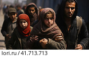 Portrait of Refugees on middle east looking at camera. Homeless people, unhappy and frightened, shawl camps,  Generative AI. Стоковое AI-изображение, AI-художник Анна Кривицкая / Фотобанк Лори