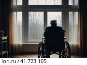 Senior man disabled sitting alone in wheelchair looking through window at hospital, lonely elder thoughtful sad old man look outside in bedroom at retirement home, feel depressed lonely. AI. Стоковое AI-изображение, AI-художник Sergey Grishin / Фотобанк Лори