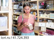 Woman choosing sundries storage box. Стоковое фото, фотограф Яков Филимонов / Фотобанк Лори