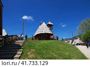 Drvengrad, Serbia - 27 Apr 2018: The church in Drvengrad village, Serbia. Редакционное фото, фотограф Сергей Стрелков / Фотобанк Лори