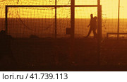 The Victory Celebration: Friends Rejoicing on a Soccer Field During a Stunning Sunset. Стоковое видео, видеограф Константин Шишкин / Фотобанк Лори