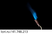 Gas burner flame. Blue fire isolated on black background, close-up. Blue flame switched on from nozzle of gas torch. Flame of manual Butane burner. VFX, Compositing as jet rocket propulsion, spaceship. Стоковое видео, видеограф Марина Демидюк / Фотобанк Лори