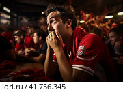 Heartbroken man experiences disappointment as his beloved football club loses a crucial match. Стоковое AI-изображение, AI-художник Юрий Поздников / Фотобанк Лори