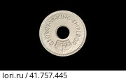 Старинная монета Фиджи на черном фоне. Obverse of Fiji coin with the name of king George VI minted from 1937 till 1952. Isolated in black background. 4k video. Стоковая анимация, аниматор Александр Кузнецов / Фотобанк Лори