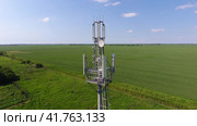 Cellular tower. Equipment for relaying cellular and mobile signal. Fly around the communications tower. Стоковое фото, фотограф Леонид Еремейчук / Фотобанк Лори