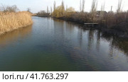 River eric current in the village in the spring. Shallow river, slowly flowing in the village. Стоковое фото, фотограф Леонид Еремейчук / Фотобанк Лори
