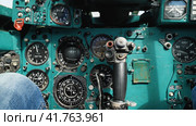 Cockpit of an old Soviet Mig-23 fighter. Close-up of instruments, gauges and controls. Switches, buttons and analogue controls of a decommissioned military aircraft. Стоковое фото, фотограф Воловодов Владимир / Фотобанк Лори